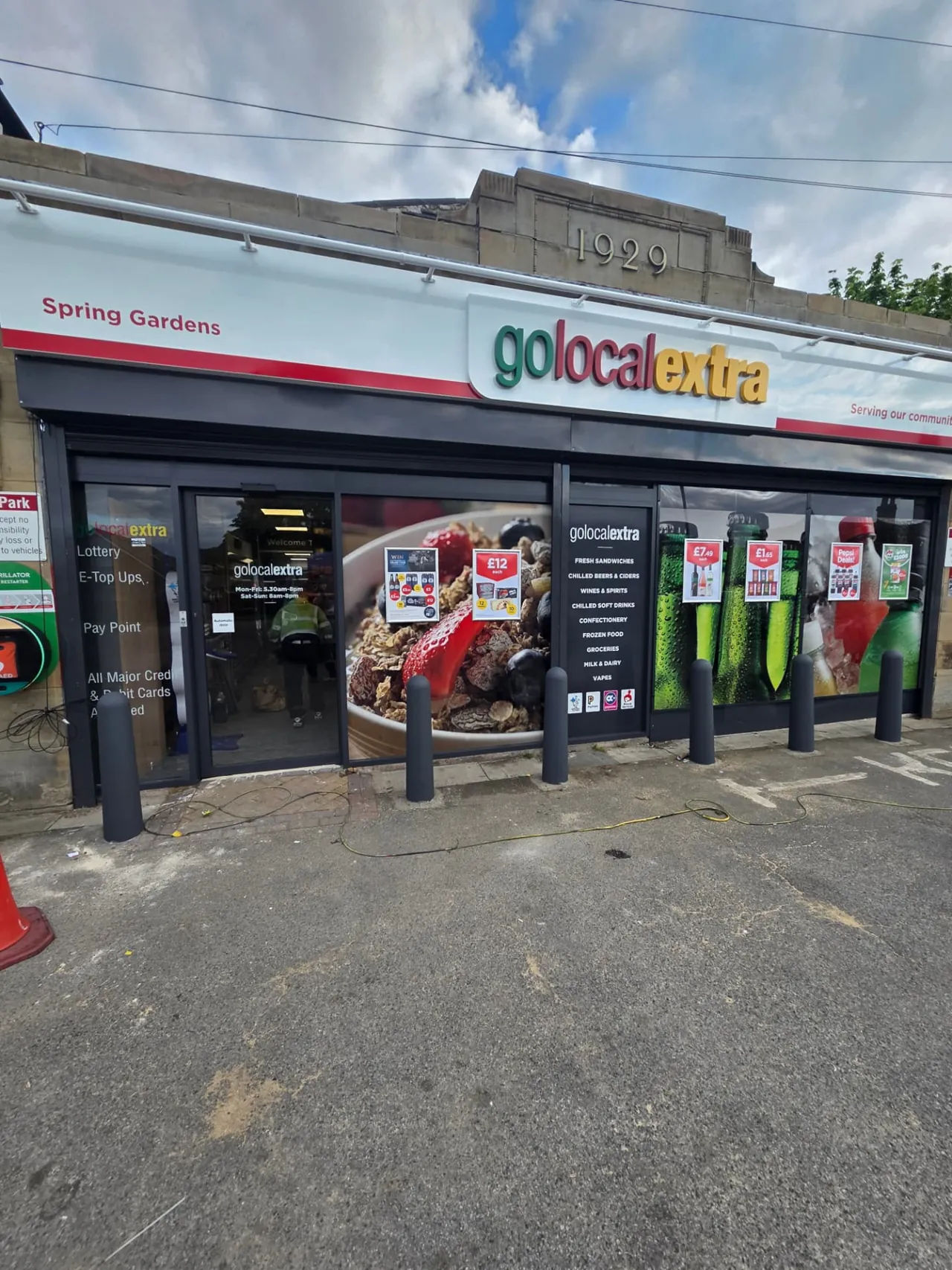 Company-supplied photograph of a Go Local convenience store shopfront with resprayed black frontage